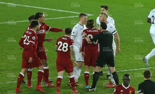 220118 - Swansea City v Liverpool - Premier League - Tensions boil over between Emre Can of Liverpool and Mike van der Hoorn of Swansea City at full time