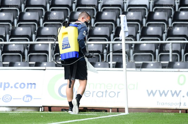 270620 - Swansea City v Luton - SkyBet Championship - Swansea City staff disinfect the pitch flags