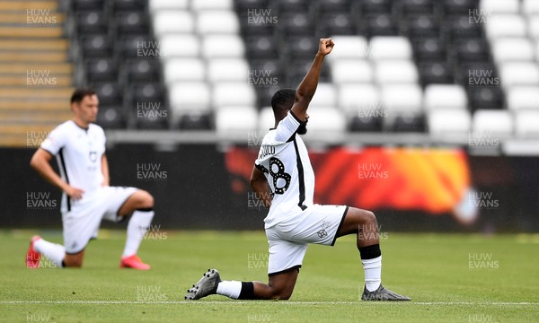 270620 - Swansea City v Luton - SkyBet Championship - Aldo Kalulu of Swansea City takes a knee after kick off
