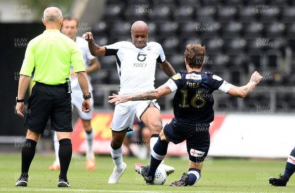 270620 - Swansea City v Luton - SkyBet Championship - Andre Ayew of Swansea City is tackled by Glen Rea of Luton
