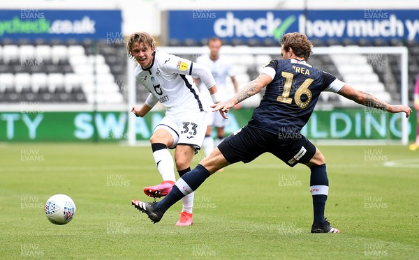 270620 - Swansea City v Luton - SkyBet Championship - Conor Gallagher of Swansea City gets the ball past Glen Rea of Luton