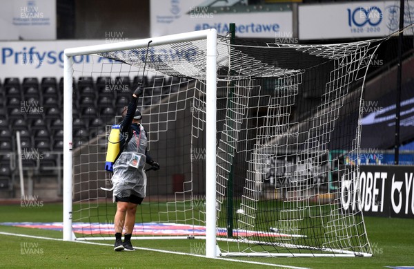 270620 - Swansea City v Luton - SkyBet Championship - Swansea City staff disinfect the goal posts