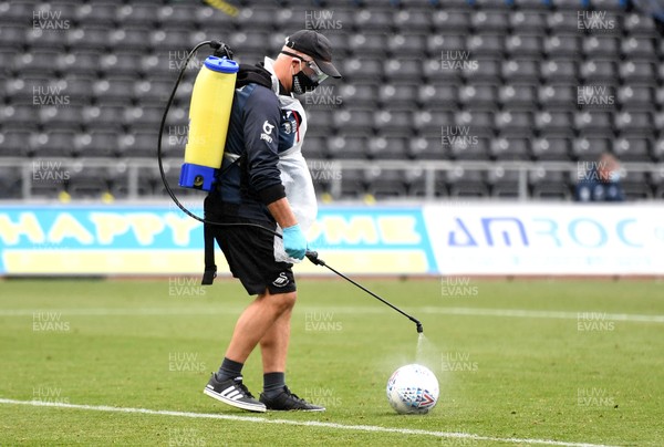 270620 - Swansea City v Luton - SkyBet Championship - Swansea City staff disinfect the match ball