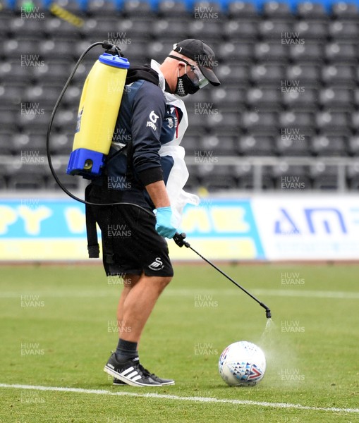 270620 - Swansea City v Luton - SkyBet Championship - Swansea City staff disinfect the match ball