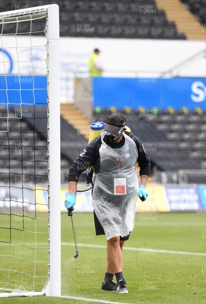 270620 - Swansea City v Luton - SkyBet Championship - Swansea City staff disinfect the goal posts
