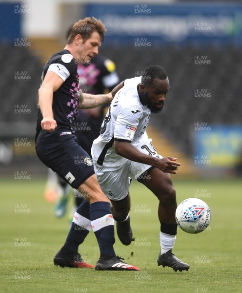 270620 - Swansea City v Luton - SkyBet Championship - Aldo Kalulu of Swansea City is tackled by James Collins of Luton