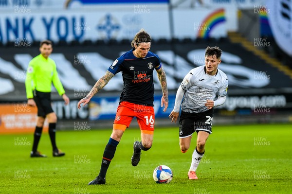 051220 - Swansea City v Luton Town - Sky Bet Championship - Glen Rea of Luton Town makes his way past Liam Cullen of Swansea City 