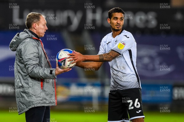 051220 - Swansea City v Luton Town - Sky Bet Championship - Swansea Manager, Steve Cooper passes the ball to Kyle Naughton of Swansea City 