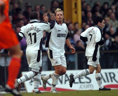 3-02-04 Swansea City v Macclesfield Town Swansea's Lee Trundle celebrates goal wil Lenny Johnrose (left)  