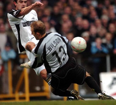 3-02-04 Swansea City v Macclesfield Town Swansea's James Thomas gets close as he watches his shot saved by Steve Wilson  