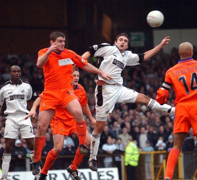 3-02-04 Swansea City v Macclesfield Town Swansea's James Thomas fails to connect as he beats Matt Hadrell  