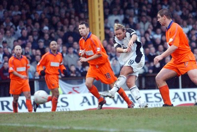 3-02-04 Swansea City v Macclesfield Town Swansea's Lee Trundle puts ball past 'keeper Steve Wilson  