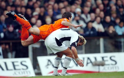 3-02-04 Swansea City v Macclesfield Town Swansea's Lee Trundle gives Michael Carr a lift  