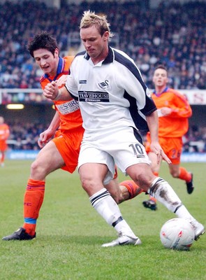 3-02-04 Swansea City v Macclesfield Town Swansea's Lee Trundle gets past Steve Macauley  