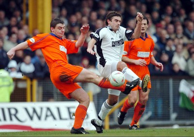 3-02-04 Swansea City v Macclesfield Town Swansea's James Thomas tries to get past Matt Hadrell  