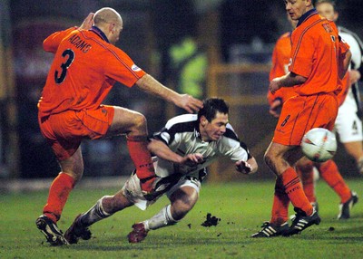 3-02-04 Swansea City v Macclesfield Town Swansea's Brad Maylett is felled by Danny Adams  