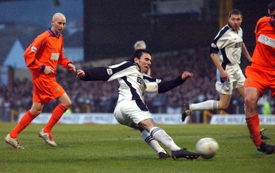 3-02-04 Swansea City v Macclesfield Town Swansea's Leon Britton gets close with shot on goal  