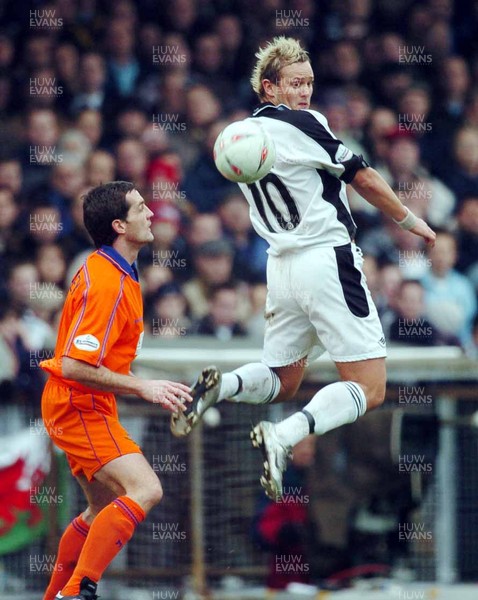 3-02-04 Swansea City v Macclesfield Town Swansea's Lee Trundle gets ball past Michael Carr  