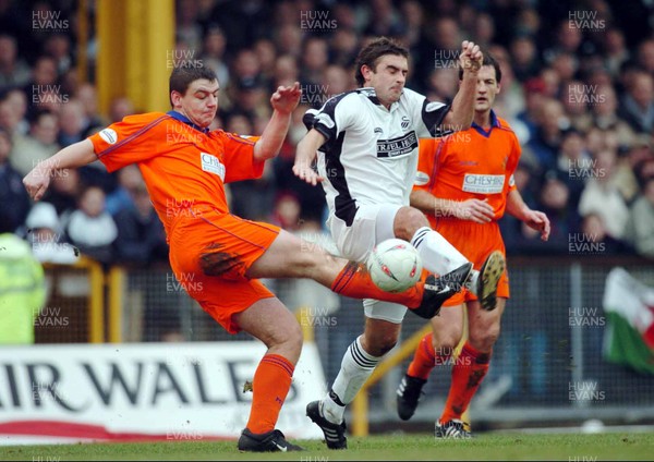 3-02-04 Swansea City v Macclesfield Town Swansea's James Thomas tries to get past Matt Hadrell  