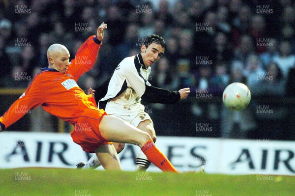 3-02-04 Swansea City v Macclesfield Town Swansea's Leon Britton gets shot past Danny Whittaker  