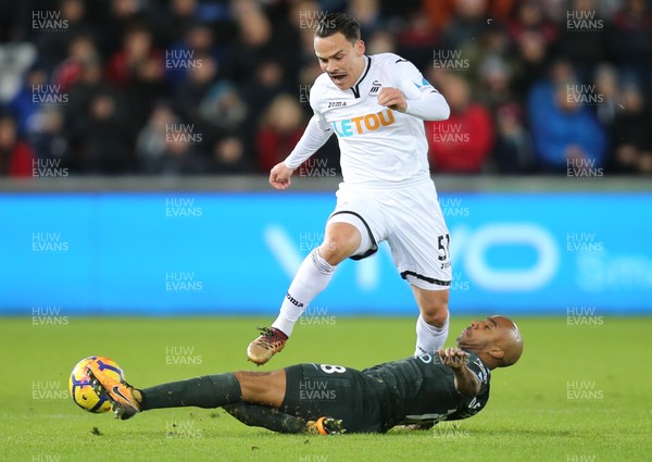 131217 - Swansea City v Manchester City, Premier League - Roque Mesa of Swansea City is tackled by Fabian Delph of Manchester City