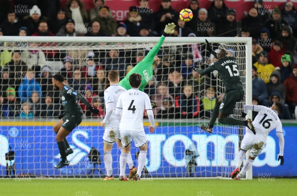 131217 - Swansea City v Manchester City, Premier League - Swansea City goalkeeper Lukasz Fabianski tips the ball over the bar as Eliaquim Mangala of Manchester City closes in