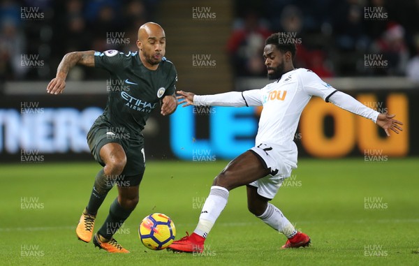 131217 - Swansea City v Manchester City, Premier League - Fabian Delph of Manchester City is challenged by Nathan Dyer of Swansea City