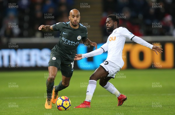 131217 - Swansea City v Manchester City, Premier League - Fabian Delph of Manchester City is challenged by Nathan Dyer of Swansea City