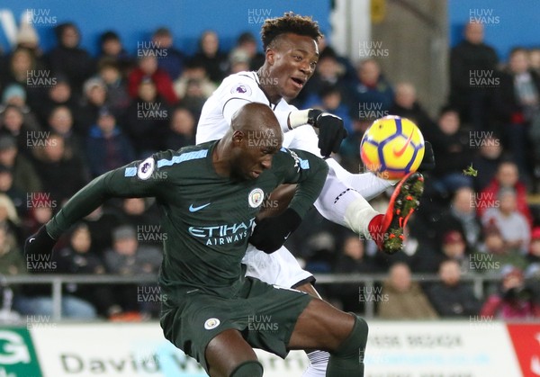 131217 - Swansea City v Manchester City, Premier League - Tammy Abraham of Swansea City and Eliaquim Mangala of Manchester City compete for the ball
