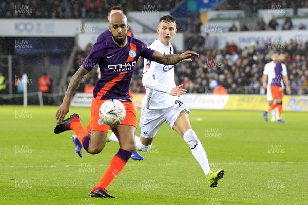 160319 - Swansea City v Manchester City, FA Cup Sixth Round - Fabian Delph of Manchester City (left) and Bersant Celina of Swansea City battle for the ball