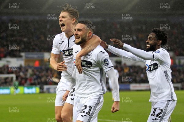 160319 - Swansea City v Manchester City, FA Cup Sixth Round - Matt Grimes of Swansea City (centre) celebrates scoring his side's first goal with George Byers and Nathan Dyer