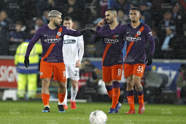 160319 - Swansea City v Manchester City, FA Cup Sixth Round - Sergio Aguero of Manchester City (left) celebrates scoring his side's second goal with team-mates