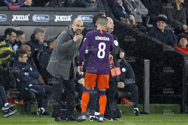 160319 - Swansea City v Manchester City, FA Cup Sixth Round - Manchester City Manager Pep Guardiola gets a message to Ilkay Gundogan