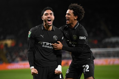 291025 - Swansea City v Manchester City - Carabao Cup Round 4 - Omar Marmoush of Manchester City celebrates scoring a goal with Oscar Bobb of Manchester City