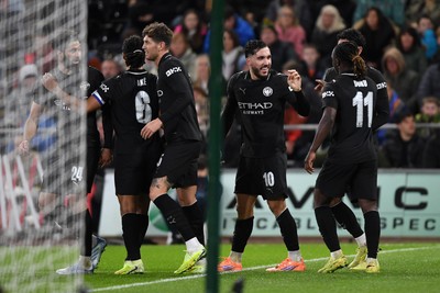 291025 - Swansea City v Manchester City - Carabao Cup Round 4 - Rayan Cherki of Manchester City celebrates scoring a goal with team mates