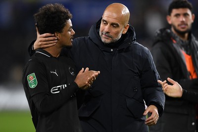 291025 - Swansea City v Manchester City - Carabao Cup Round 4 - Pep Guardiola, Manchester City Manager with Oscar Bobb of Manchester City at full time