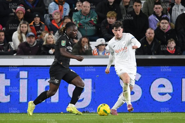 291025 - Swansea City v Manchester City - Carabao Cup Round 4 - Josh Key of Swansea City is challenged by Jeremy Doku of Manchester City