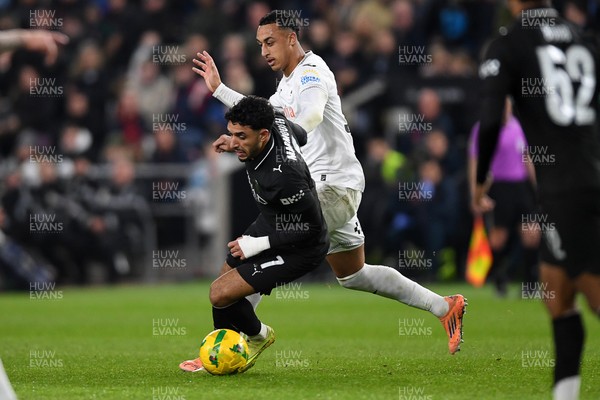 291025 - Swansea City v Manchester City - Carabao Cup Round 4 - Omar Marmoush of Manchester City is challenged by Adam Idah of Swansea City