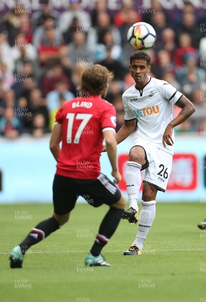 190817 - Swansea City v Manchester United, Premier League - Kyle Naughton of Swansea City plays the ball past Daley Blind of Manchester United