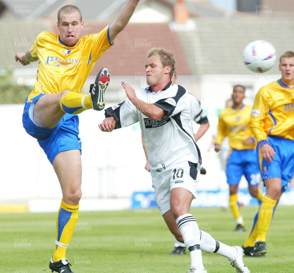 300803 - Swansea City v Mansfield Town - Third Division - Mansfield's Rhys Day clears under pressure from Lee Trundle