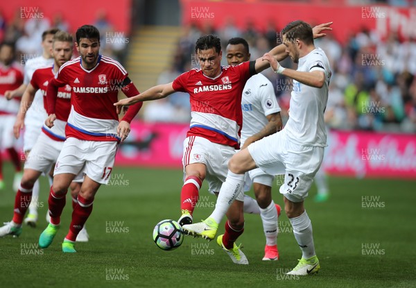 020417 - Swansea City v Middlesbrough, Premier League - Gylfi Sigurdsson of Swansea City wins the ball from Bernardo Espinosa of Middlesbrough