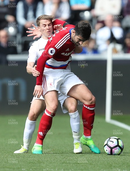 020417 - Swansea City v Middlesbrough, Premier League - Tom Carroll of Swansea City and Antonio Barragan of Middlesbrough compete for the ball