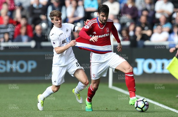 020417 - Swansea City v Middlesbrough, Premier League - Tom Carroll of Swansea City and Antonio Barragan of Middlesbrough compete for the ball