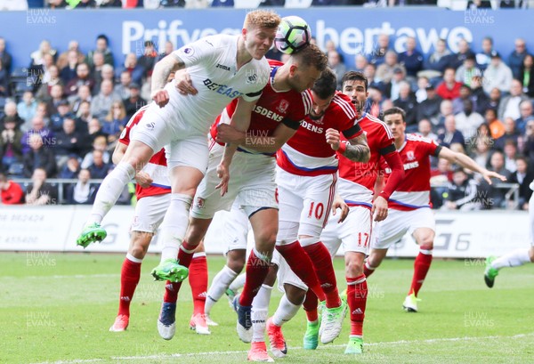 020417 - Swansea City v Middlesbrough, Premier League - Alfie Mawson of Swansea City and Bernardo Espinosa of Middlesbrough compete for the ball inferno of the Middlesbrough goal