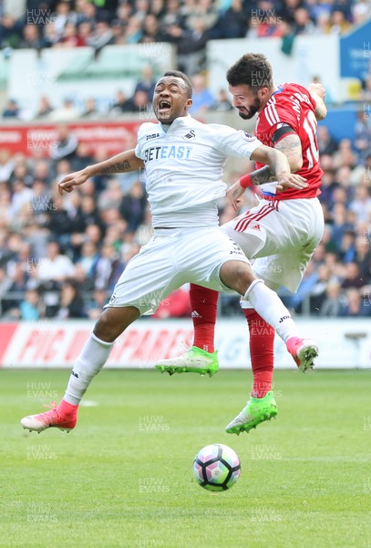 020417 - Swansea City v Middlesbrough, Premier League - Jordan Ayew of Swansea City and Alvaro Negredo of Middlesbrough compete for the ball