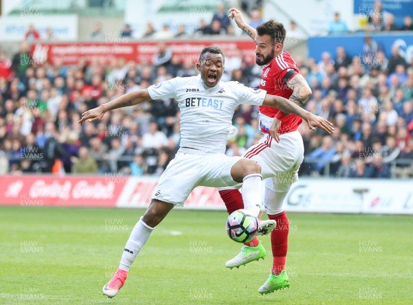 020417 - Swansea City v Middlesbrough, Premier League - Jordan Ayew of Swansea City and Alvaro Negredo of Middlesbrough compete for the ball