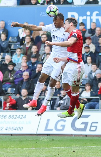 020417 - Swansea City v Middlesbrough, Premier League - Jordan Ayew of Swansea City and Bernardo Espinosa of Middlesbrough compete for the ball