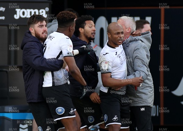 060321 - Swansea City v Middlesbrough - SkyBet Championship - Andre Ayew of Swansea City celebrates scoring a goal with the dugout and team mates