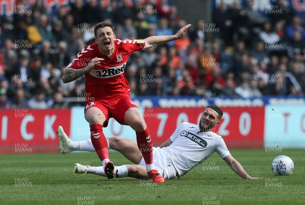 060419 - Swansea City v Middlesbrough, Premier League - Jordan Hugill of Middlesbrough is tackled by Matt Grimes of Swansea City