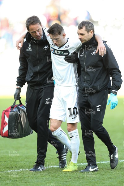 060419 - Swansea City v Middlesbrough, Premier League - Bersant Celina of Swansea City is helped from the pitch at the end of the match